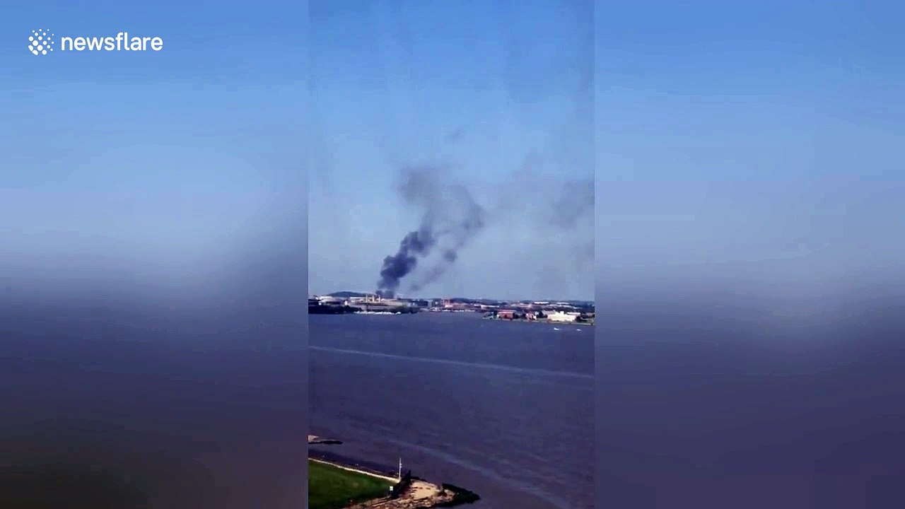 100 firefighters at scene as smoke billows from...