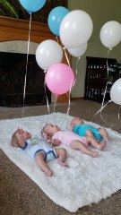 Triplets Playing with Balloons