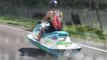 Driver Reacts With Astonishment to Jet Ski Moving on Land