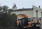 Resourceful Neighbors Use JCB to Hold Down Roof During Storm Ali
