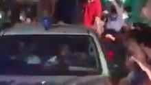 Crowd Showers Petals on Former Prime Minster's Car After Release From Jail