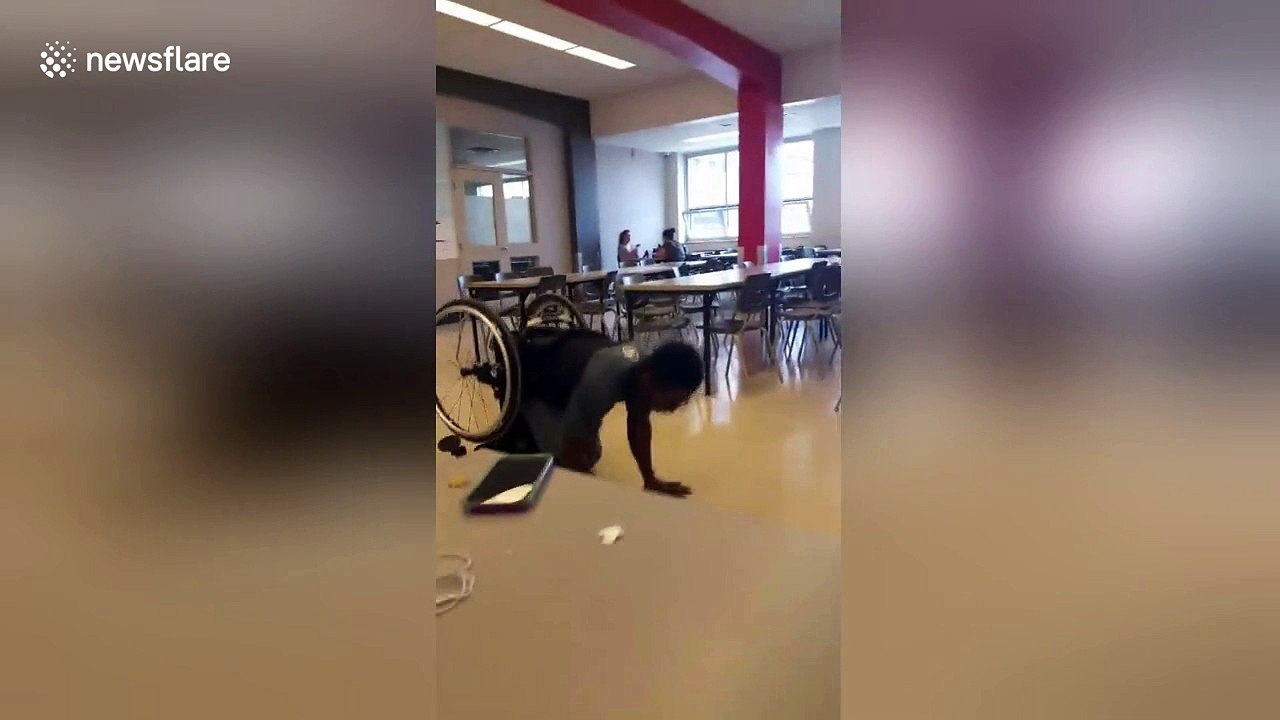 Inspirational Montreal student does handstand push-ups while in wheelchair