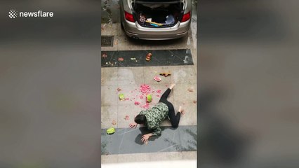 Slapstick as man slips up and smashes watermelon