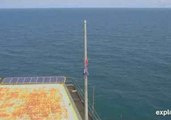 Tattered US Flag Remains on Frying Pan Tower as Camera Turns Back on After Florence