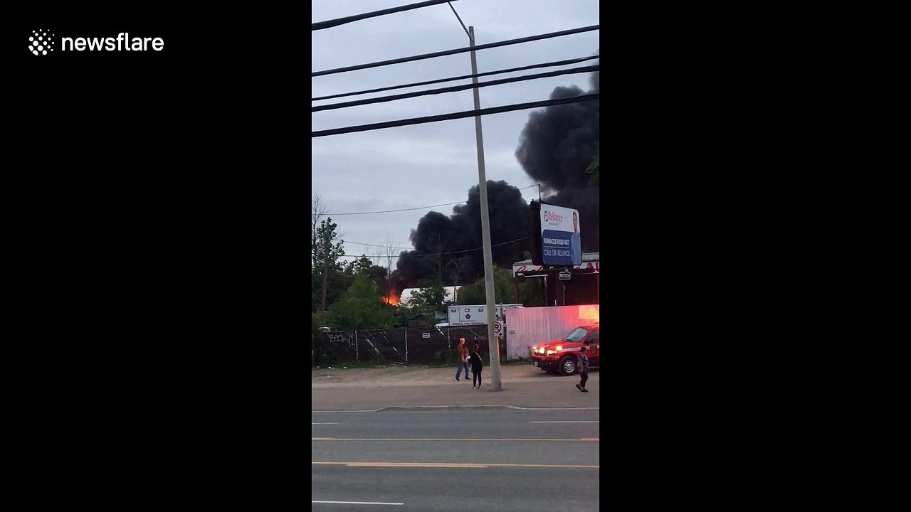 Black smoke seen billowing from massive Mississauga auto yard fire