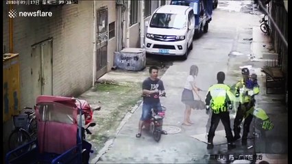 Police and delivery man catch baby falling from first-floor balcony