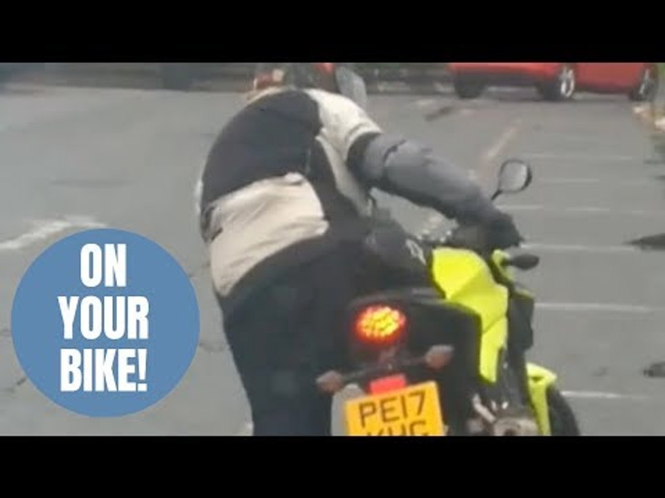 Hilarious footage shows biker struggling to mount bike