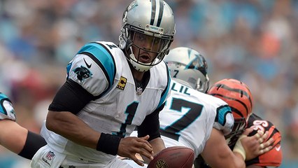 Cam Newton muscles through dogpile to recover his own fumble