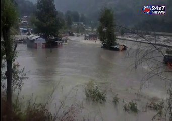 Vacant trucks  gets washed away into the flooded Beas river in Manali HimachalPradesh