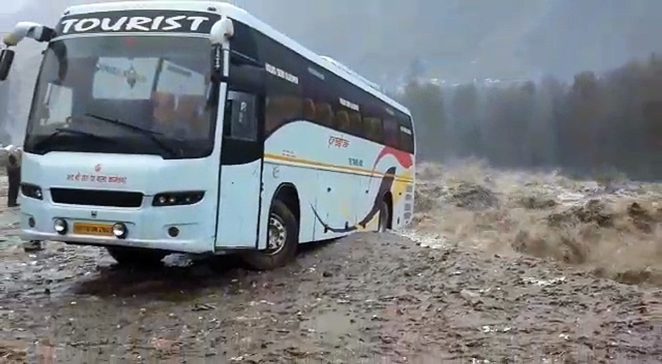 This Bus is going swimming into a flooded river!