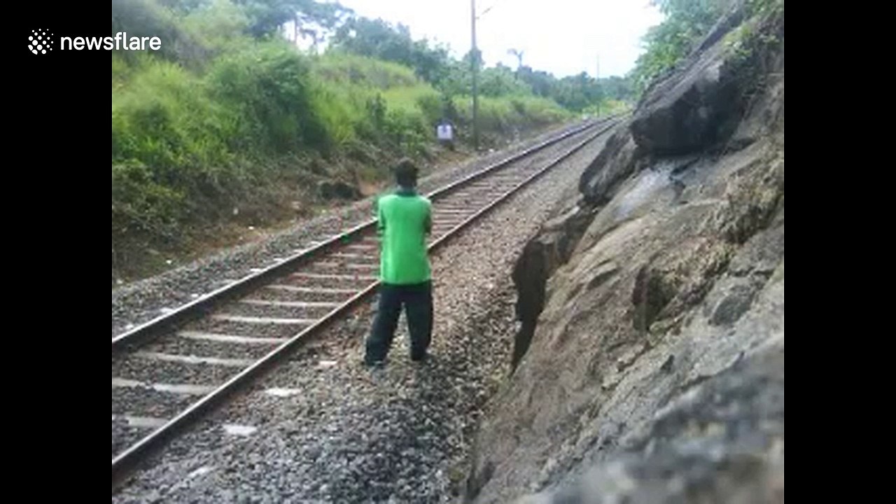 Man risks his life lying on railway tracks as train speeds over him ...