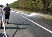 North Carolina Firefighters Turn Hoses on Fish Left High and Dry by Receding Floodwaters