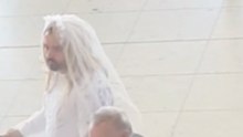 Here Comes the Bride: Man Walks Through Dublin Airport in Wedding Dress
