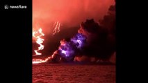 Lightning streaks through night skies as Galapagos volcano erupts