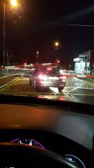Impatient Driver Forces Car Under Train Barriers