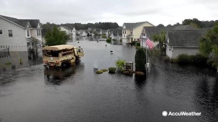 Residents of Conway, South Carolina, react to rising floodwaters