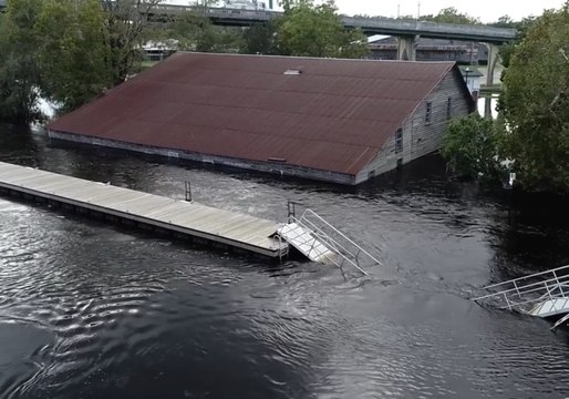 Floodwater Rising in Conway, Buildings Remain Submerged
