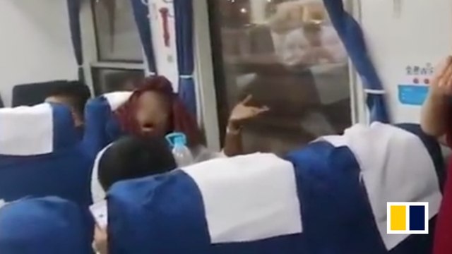Woman in wrong seat on train throws water at passengers