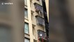 Firefighters rescue toddler hanging out of 9th-floor balcony