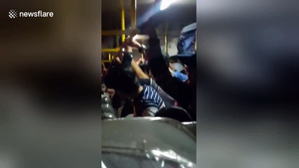 Bus driver dubbed 'spiderman' after dangling from roof to collect fares