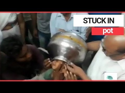 Boy gets head stuck in metal pot | SWNS TV
