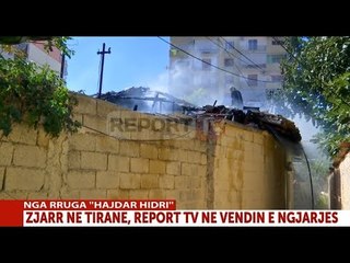Report TV - Zjarr në Tiranë, digjet një banesë pranë tregut "Çam", nxirret me shpejtësi e moshuara
