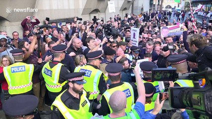 Chaotic scenes as Tommy Robinson enters court