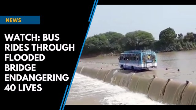 Watch: Bus rides through flooded bridge endangering 40 lives