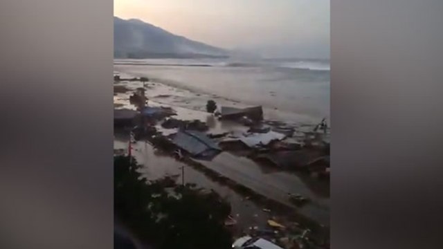Video shows tsunami hitting Indonesian city after 7.5-magnitude quake