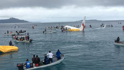 All passengers safe after plane misses runway and crashes into lagoon in Micronesia