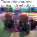 These kids looking at theirs reflections are adorable!