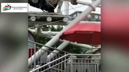 Boy dangles by his NECK 130ft in air from ferris wheel cabin after falling through window