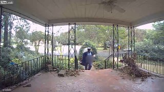 Mailman urinating while walking on the front porch of home while delivering mail