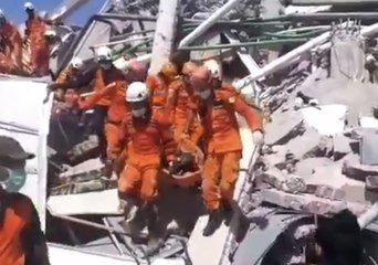 Rescuers Carry Bodies From Collapsed Roa Roa Hotel in City of Palu