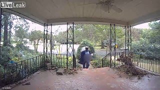 Mailman urinating while walking on the front porch of home while delivering mail