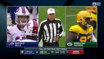 Kenny Clark strips Josh Allen near the turf for a fumble