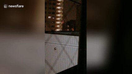 Footage shows lights in apartment windows flickering non-stop as typhoon bears down on Tokyo