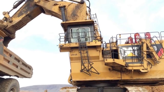 Cat 6040 Excavator Loading Hitachi Dumpers, Operator View