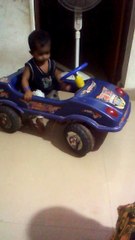 My son learning to drive in the living room - watch out!