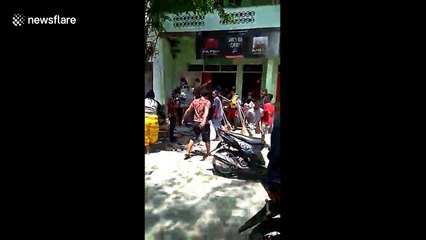 People in Donggala loot shops four days after earthquake and tsunami