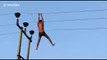 'Drunk' Indian man swings from high-voltage power lines