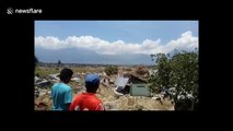 Footage shows ground cracked, structures reduced to rubble after 7.5-magnitude earthquake devastates Indonesian island