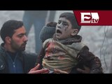 Rescatan a niños heridos tras bombardeo en  Siria / Andrea Newman