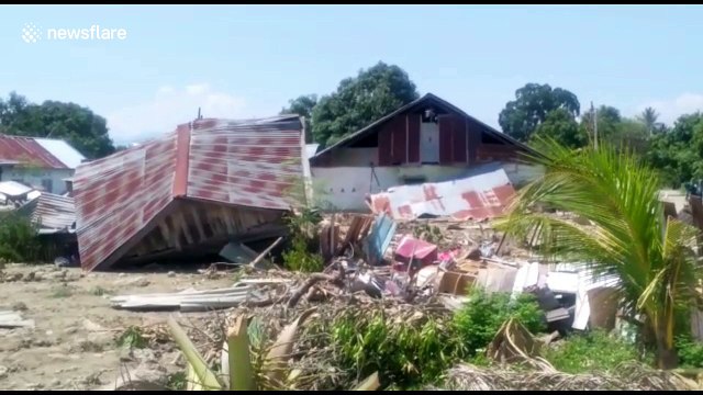 Rescuers retrieve bodies from the area as death toll passes 1,400 in Palu, Indonesia