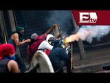 Duros enfrentamientos entre encapuchados y policias venezolanos/ Titulares de la tarde