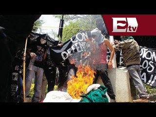 Consignan a 9 encapuchado por quemar bandera en Oaxaca / Excélsior Informa
