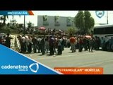 Normalistas michoacanos bloquean con autobuses avenidas de Morelia