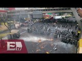 Enfrentamiento entre encapuchados y policías / Titulares de la tarde