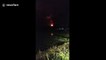 Sky lights up during volcanic lava eruptions in Indonesia