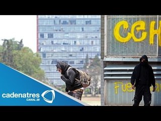 Encapuchados realizan pintas en la Torre de Rectoría
